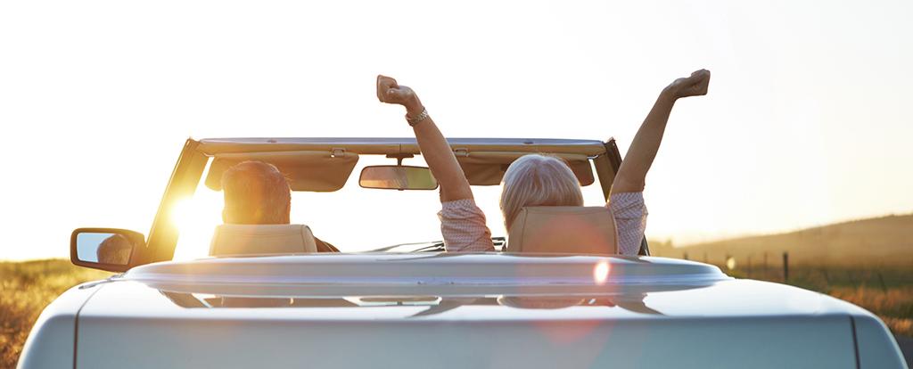 Seniors Driving Into The Sunset